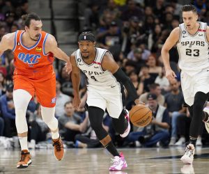 Mar 12, 2023; San Antonio, Texas, USA; San Antonio Spurs guard Devonte' Graham (4) dribbles up the court while defended by Oklahoma City Thunder forward Dario Saric (9) during the first half at AT&T Center. Mandatory Credit: Scott Wachter-USA TODAY Sports Photo: Scott Wachter/REUTERS