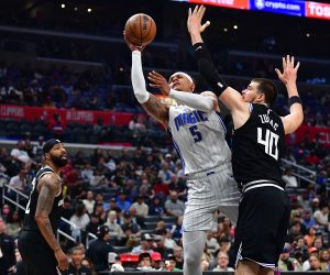Mar 18, 2023; Los Angeles, California, USA; Orlando Magic forward Paolo Banchero (5) moves to the basket against Los Angeles Clippers center Ivica Zubac (40) during the second half at Crypto.com Arena. Mandatory Credit: Gary A. Vasquez-USA TODAY Sports Photo: Gary A. Vasquez/REUTERS