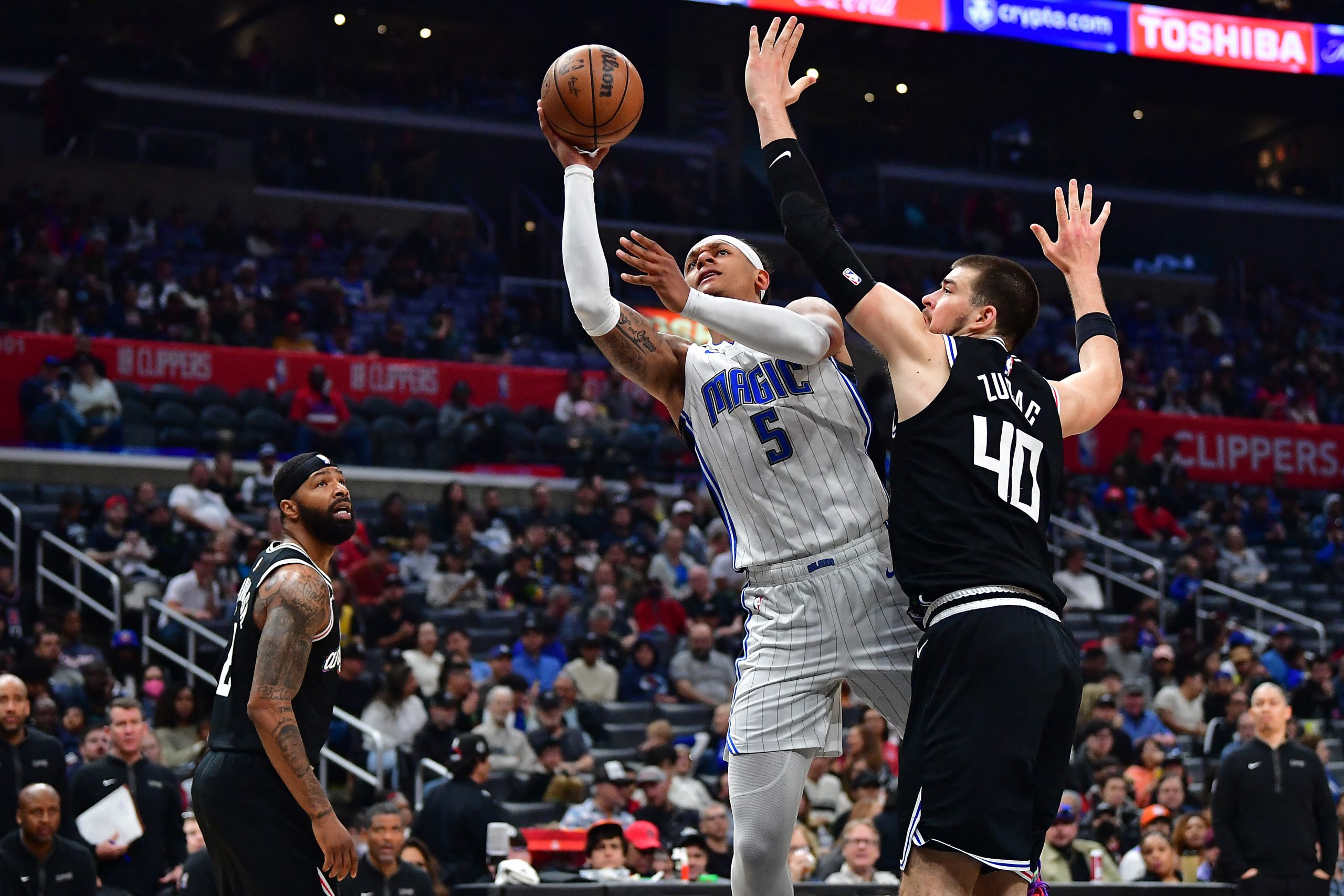 Mar 18, 2023; Los Angeles, California, USA; Orlando Magic forward Paolo Banchero (5) moves to the basket against Los Angeles Clippers center Ivica Zubac (40) during the second half at Crypto.com Arena. Mandatory Credit: Gary A. Vasquez-USA TODAY Sports Photo: Gary A. Vasquez/REUTERS