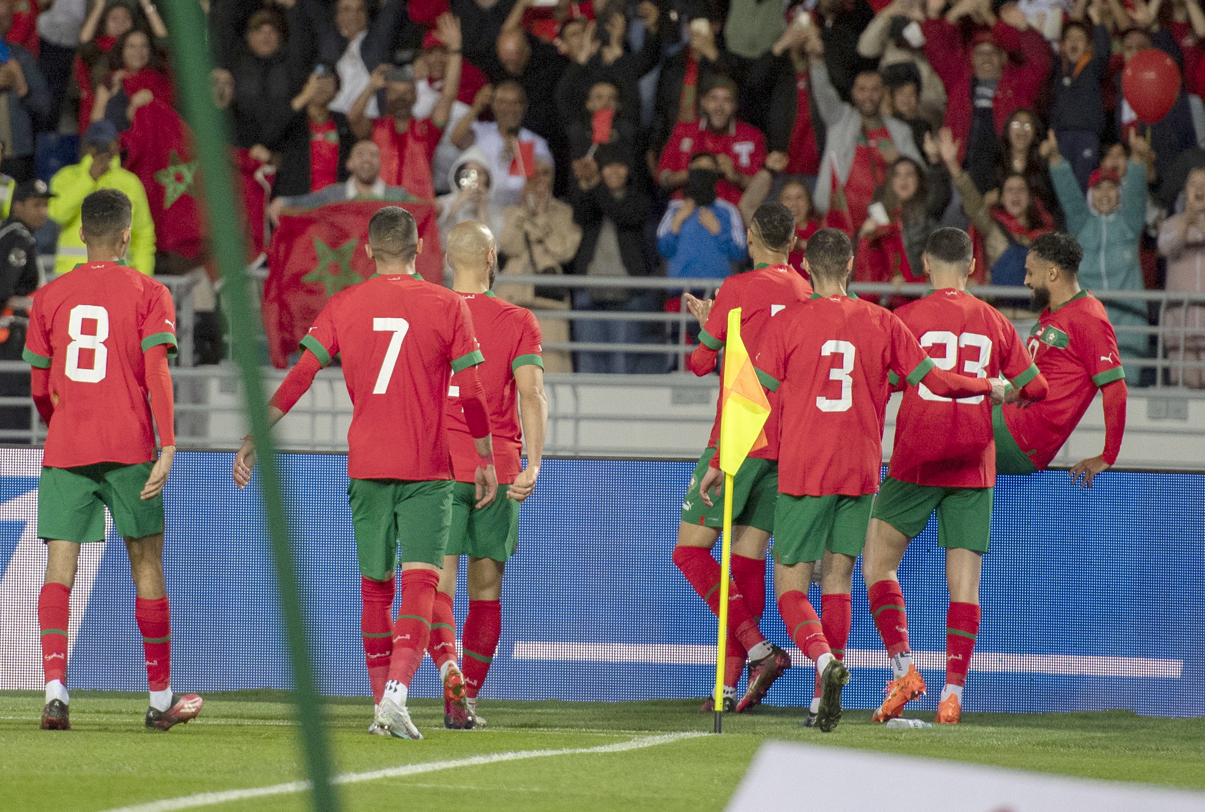 epa10543532 Moroccan players celebrate a goal during the friendly soccer match between Morocco and Brazil, in Tangier, Morocco, 25 March 2023.  EPA/Jalal Morchidi