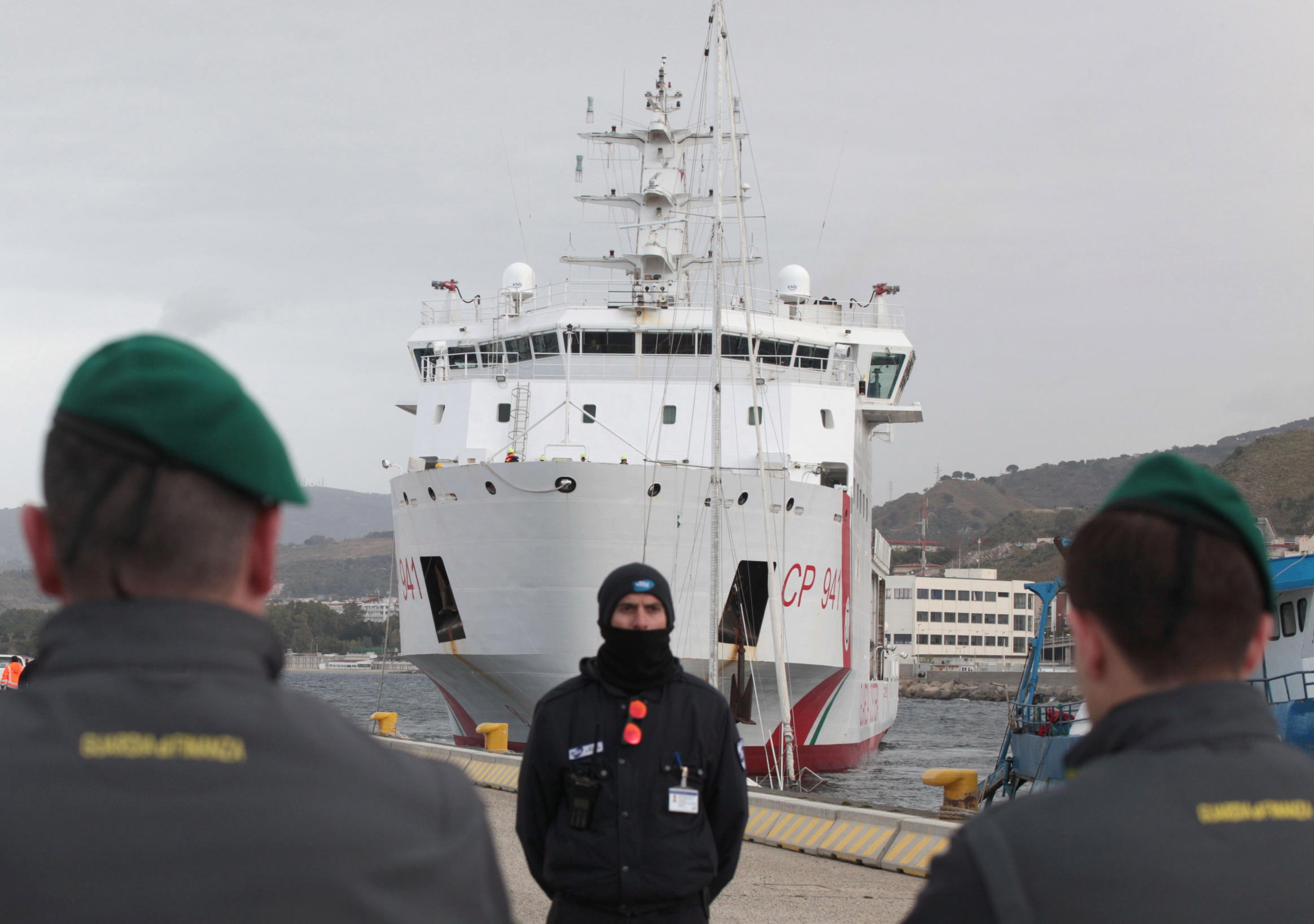 epa10514745 The Diciotti offshore patrol vessel carrying 584 migrants rescued at sea docks at a port in Reggio Calabria, southern Italy, 11 March 2023.  EPA/MARCO COSTANTINO