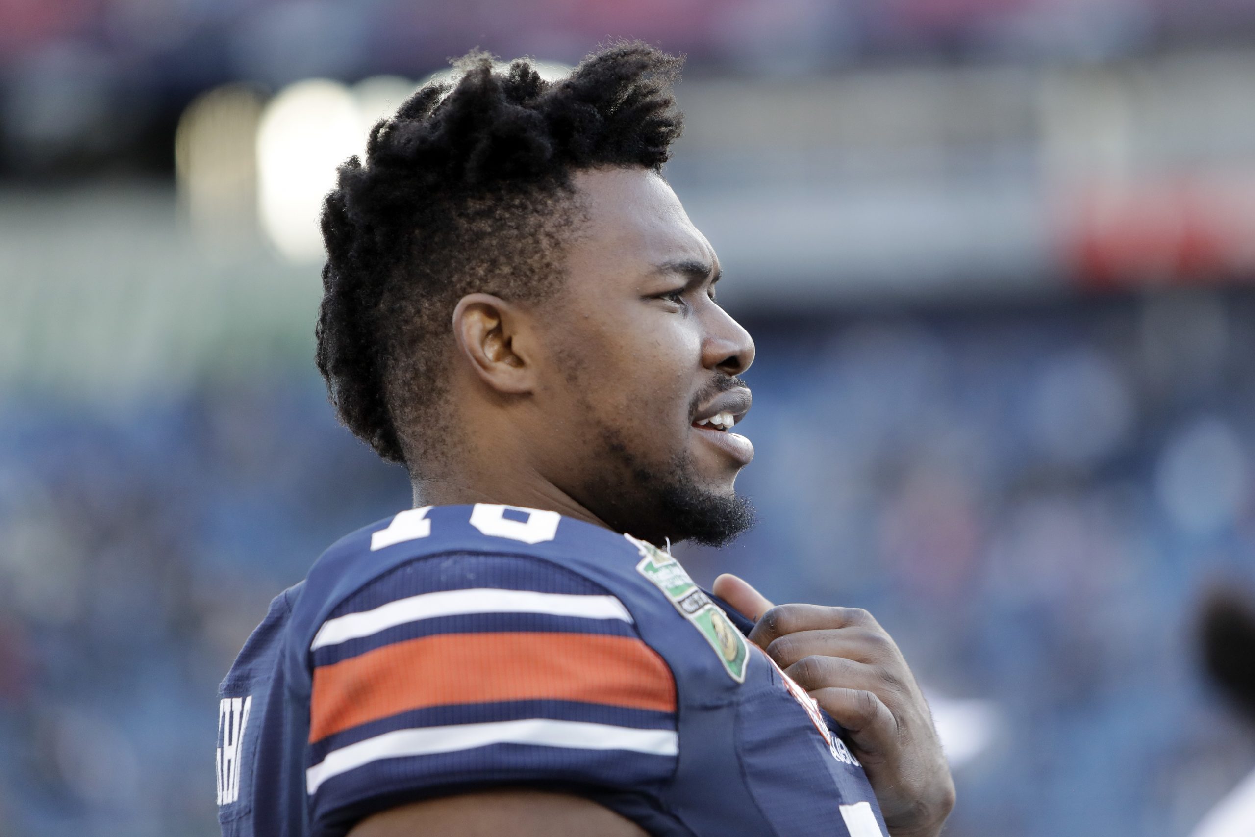Auburn offensive lineman Prince Tega Wanogho watches from the sideline in the second half of the Music City Bowl NCAA college football game against Purdue Friday, Dec. 28, 2018, in Nashville, Tenn. Auburn won 63-14. (AP Photo/Mark Humphrey)