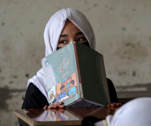 epa10543340 A schoolgirl attending up to primary grade classes sits in a classroom at the start of the new academic year in Kabul, Afghanistan, 25 March 2023. As schools reopen across the country, hundreds of thousands of teenage girls will not be able to go to classes after Taliban authorities banned female students from secondary education. UNICEF urged authorities to lift the ban on girls' and women's further education in a statement on 21 March 2023.  EPA/SAMIULLAH POPAL
