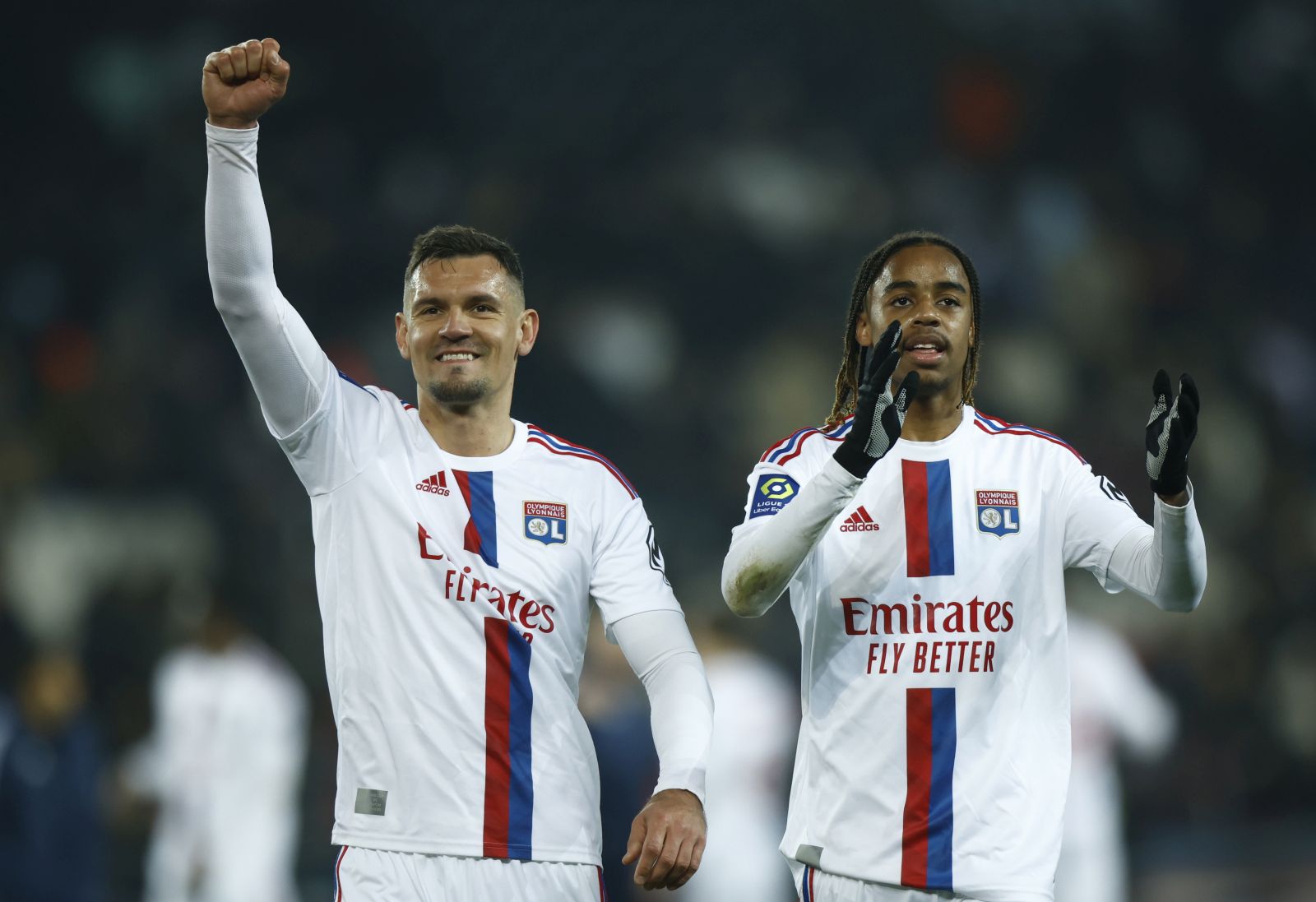 epa10556321 Lyon's Dejan Lovren (L) and Lyon's Bradley Barcola celebrate their victory during the French Ligue 1 soccer match between PSG and Olympique Lyonnais at the Parc des Princes stadium in Paris, France, 02 April 2023.  EPA/YOAN VALAT