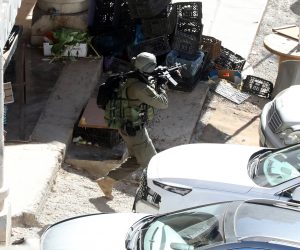 epa10556539 An Isaeli soldier takes position during an operation in the West Bank City of Nablus, 03 April 2023. Two Palestinians were killed and 20 wounded during an Israeli army raid in Nablus city early Monday 03 April, Palestinian health Ministry said.  EPA/ALAA BADARNEH