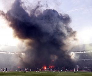 epa10560249 Supporters of Feyenoord set off fireworks during the Semifinal of the KNVB Cup match between Feyenoord Rotterdam and AFC Ajax, in Rotterdam, the Netherlands, 05 April 2023.  EPA/MAURICE VAN STEEN