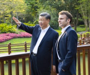 epa10564460 Chinese President Xi Jinping (L) and French President Emmanuel Macron (R) chat during a stroll through the Pine Garden in Guangzhou, Guangdong Province, China, 07 April 2023 (issued 08 April 2023).  https://www.politico.eu/article/china-skeptic-mps-emmanuel-macron-speak-europe/ CHINA OUT / MANDATORY CREDIT  EDITORIAL USE ONLY