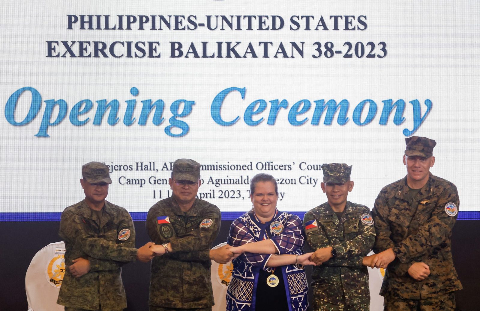 epa10567997 (L-R) Philippine Army Major General Marvin Licudine, Armed Forces of the Philippines Chief-of-Staff General Andres Centino, United States Charge d'Affaires Heather Variava, Philippine Navy (Marines) Brigadier General Noel Belaran and United States Marine Corps Major General Eric Austin link arms during the opening ceremony of the 38th Philippines-US 'Balikatan' exercise at Camp Aguinaldo in Quezon City, Metro Manila, Philippines 11 April 2023. 'Balikatan', or shoulder-to-shoulder, exercises will involve some 17,600 Philippines and US troops cooperating to develop mutual defense capability, counter-terrorism, strengthen maritime security efforts and address shared extremist threats.  EPA/ROLEX DELA PENA