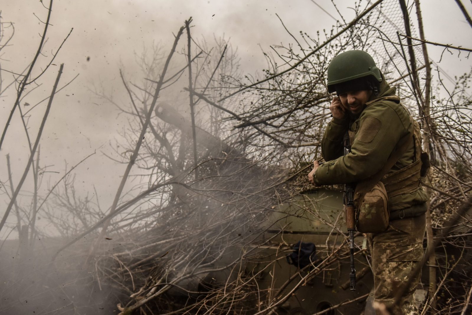 epa10569840 A Ukrainian artilleryman of the 57th Otaman Kost Hordiienko Separate Motorized Infantry Brigade as a 2s3 Akatsia howitzer fires at an undisclosed position near outskirts of Bakhmut, Donetsk region, Ukraine, 12 April 2023. Russian troops entered Ukrainian territory on 24 February 2022, starting a conflict that has provoked destruction and a humanitarian crisis.  EPA/OLEG PETRASYUK