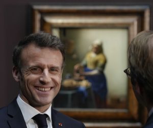 epa10569975 French President Emmanuel Macron smiles during a visit in the Rijksmuseum in Amsterdam, The Netherlands, 12 April 2023. The French president and his wife are paying a two-day state visit to the Netherlands.  EPA/PETER DE JONG / POOL