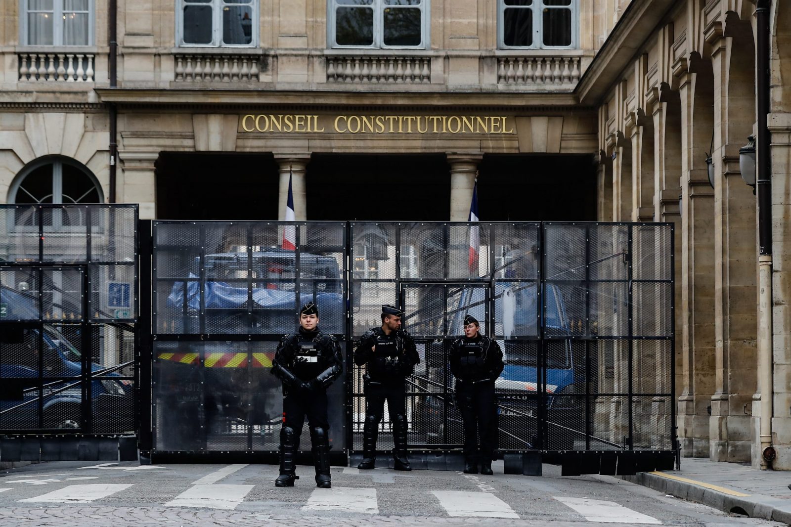 epa10572199 Gendarmerie officers in anti-riot gear secure the access to the French Constitutional Council in Paris, France, 14 April 2023. The 'sages', members of the Constitutional Council, were due to deliver their verdict on 14 April concerning the examination of the text of the pension reform, after almost three months of social conflict. Many demonstrations are planned throughout the country following the verdict’s announcement.  EPA/TERESA SUAREZ