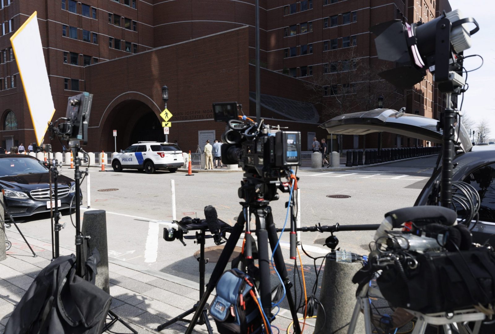 epa10572578 Television news crews set up outside the John Joseph Moakley Federal Courthouse, where the hearing for Jack Douglas Teixeira, who served as an Air National Guardsman and is now a suspect in a US intelligence leak, is to be held in Boston, Massachusetts, USA, 14 April 2023. Teixeira was taken into custody at his home in North Dighton, Massachustts, on 13 April 2023, by US authorities, as confirmed by the US Attorney General in a statement, as part of a Justice Department inquiry into the intelligence documents which were leaked online starting in March 2023.  EPA/CJ GUNTHER