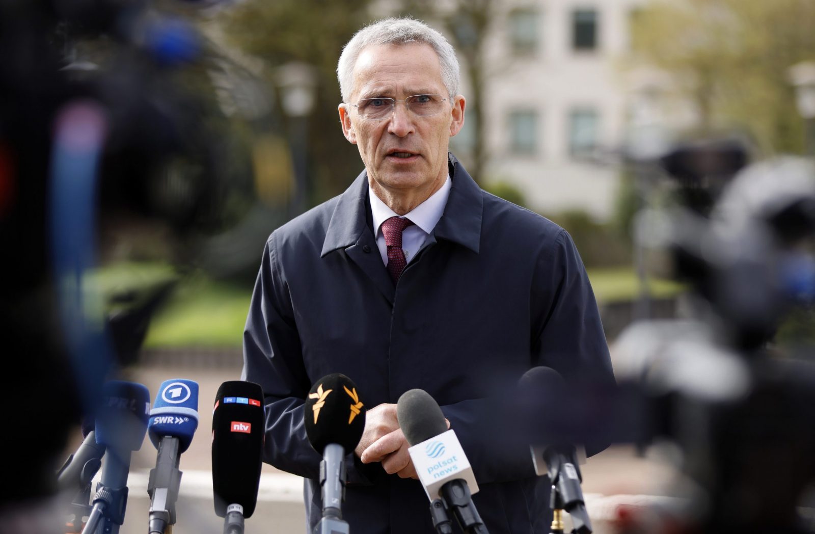 epa10583641 NATO Secretary General Jens Stoltenberg speaks to the media before the fourth meeting of Ukraine Defense Contact Group at the US Air Base in Ramstein, Germany, 21 April 2023. The US Secretary of Defense has invited Ministers of Defense and senior military officials from around the world to Ramstein to discuss the ongoing crisis in Ukraine and various security issues facing US allies and partners.  EPA/RONALD WITTEK