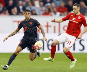 epa10585693 Munich's Joao Cancelo (L) in action against Mainz’s Dominik Kohr (R) during the German Bundesliga soccer match between 1. FSV Mainz 05 and FC Bayern Munich in Mainz, Germany, 22 April 2023.  EPA/RONALD WITTEK CONDITIONS - ATTENTION: The DFL regulations prohibit any use of photographs as image sequences and/or quasi-video.