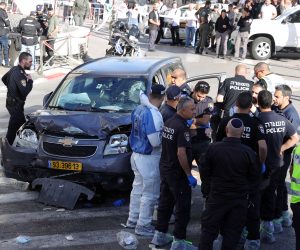 epa10589292 Israeli security forces inspect the scene following an incident near the Mahane Yehuda market in Jerusalem, 24 April 2023. According to the police, at least five persons were injured after a car ran into a crowd in Jerusalem, adding that the driver was killed at the scene.  EPA/ABIR SULTAN
