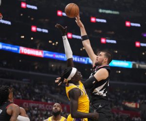 Apr 5, 2023; Los Angeles, California, USA; LA Clippers center Ivica Zubac (40) shoots the ball against Los Angeles Lakers forward Wenyen Gabriel (35) in the first half at Crypto.com Arena. Mandatory Credit: Kirby Lee-USA TODAY Sports Photo: Kirby Lee/REUTERS