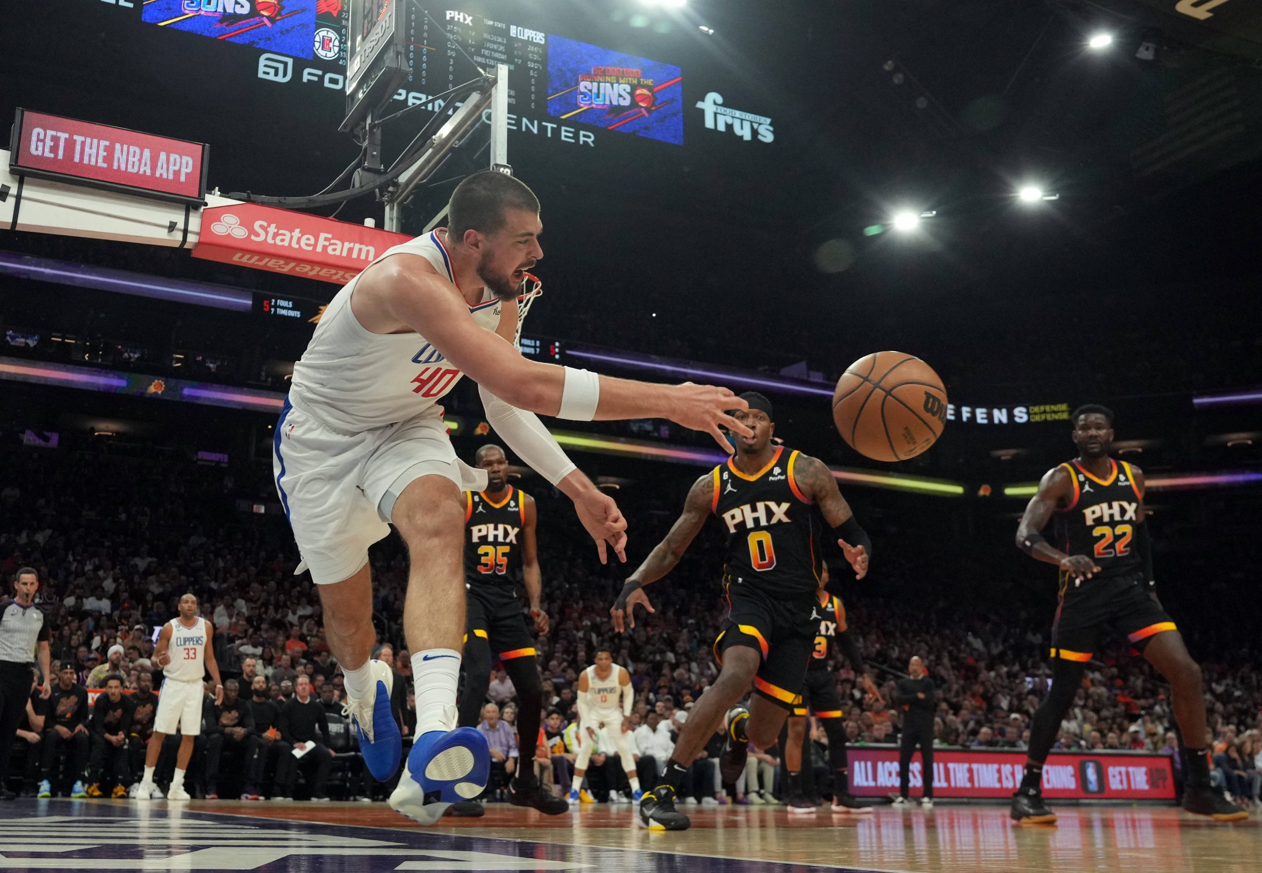 Apr 16, 2023; Phoenix, Arizona, USA; LA Clippers center Ivica Zubac (40) attempts to save a ball from going out of bounds during the first half of game one of the 2023 NBA playoffs between the Phoenix Suns and the LA Clippers at Footprint Center. Mandatory Credit: Joe Camporeale-USA TODAY Sports Photo: Joe Camporeale/REUTERS