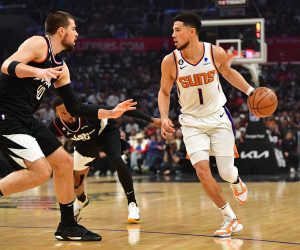 Apr 22, 2023; Los Angeles, California, USA; Phoenix Suns guard Devin Booker (1) moves the ball against Los Angeles Clippers center Ivica Zubac (40) during the first half in game four of the 2023 NBA playoffs at Crypto.com Arena. Mandatory Credit: Gary A. Vasquez-USA TODAY Sports Photo: Gary A. Vasquez/REUTERS