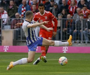 epa10600014 Munich's Joao Cancelo (R) in action against Hertha's Jonjoe Kenny (L) during the German Bundesliga soccer match between FC Bayern Munich and Hertha BSC Berlin in Munich, Germany, 30 April 2023.  EPA/RONALD WITTEK CONDITIONS - ATTENTION: The DFL regulations prohibit any use of photographs as image sequences and/or quasi-video.