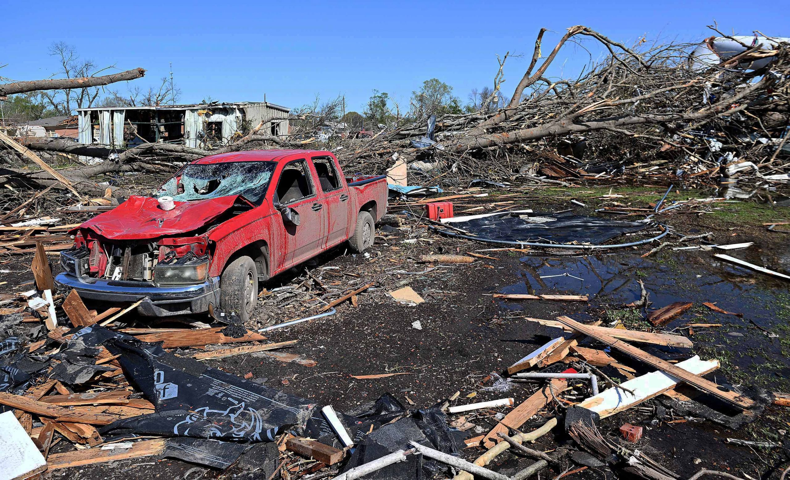 epa10544613 A destroyed car stands amid the devastation after a tornado struck in Rolling Fork, Mississippi, USA, 26 March 2023. At least 25 people have been killed in Mississippi after a tornado and severe weather outbreak on 24 March, according to the Mississippi Emergency Management Agency.  EPA/CHRIS TODD