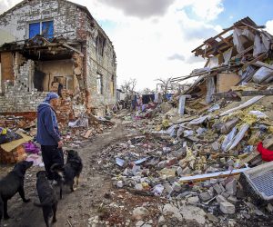 epa10545773 Local resident Gennady (49) shows the destroyed building of his neighbors in Cherkaski Tyshky, Kharkiv region, Ukraine, 27 March 2023. The Ukrainian army pushed Russian forces from occupied territory northeast of the country in counterattacks in the Autumn of 2022. Kharkiv and surrounding areas have been the target of heavy shelling since February 2022, when Russian troops entered Ukraine starting a conflict that has provoked destruction and a humanitarian crisis.  EPA/SERGEY KOZLOV