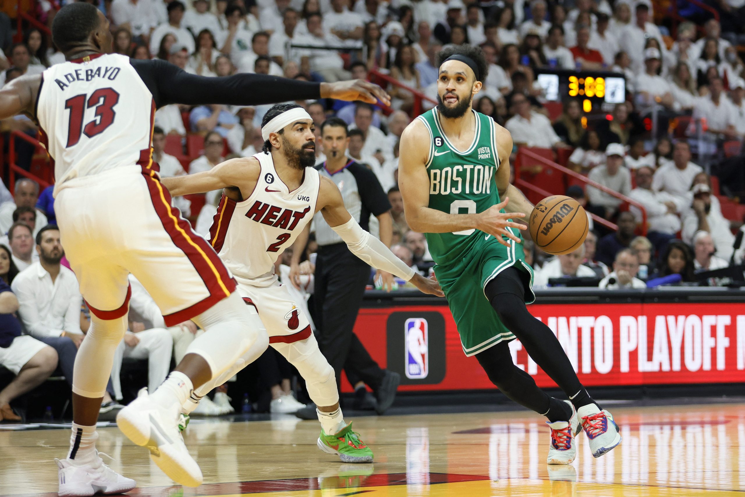 May 27, 2023; Miami, Florida, USA; Boston Celtics guard Derrick White (9) controls the ball against Miami Heat guard Gabe Vincent (2) in the fourth quarter during game six of the Eastern Conference Finals for the 2023 NBA playoffs at Kaseya Center. Mandatory Credit: Sam Navarro-USA TODAY Sports