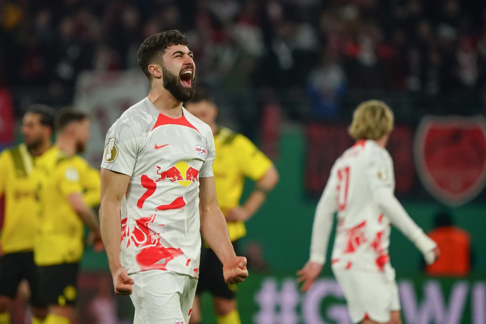 epa10560660 Josko Gvardiol of RB Leipzig celebrates after winning the German DFB Cup quarter final soccer match between RB Leipzig and Borussia Dortmund in Leipzig, Germany, 05 April 2023.  EPA/CLEMENS BILAN CONDITIONS - ATTENTION: The DFB regulations prohibit any use of photographs as image sequences and/or quasi-video.
