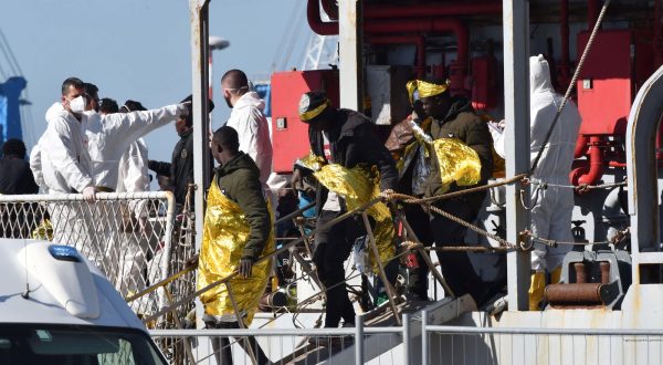 epa10594051 A group of 250 migrants transferred from the hotspot on the island of Lampedusa disembark from the Navy ship Vega in the port of Catania, Italy, 27 April 2023. About 250 migrants are going to disembark from the navy ship in Catania, while another 250 will go down to the port of the Etna capital, and will then be transferred to the first reception center set up in the former vaccination hub of San Giuseppe La Rena. Italian authorities are transferring people away from Lampedusa after the arrival of 1,078 in 20 separate landings the day before, further overcrowding the reception capacity.  EPA/ORIETTA SCARDINO