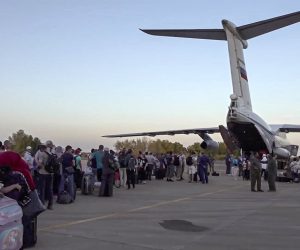 epa10603771 A handout still image taken from a handout video provided by the Russian Defence ministry press-service shows people boarding a Russian military aircraft during a military evacuation operation in the airport of Khartoum, Sudan, 02 May 2023. Four Il-76 aircrafts of the military transport aviation of the Russian Aerospace Forces evacuated more than 200 people from Sudan, employees of the Russian diplomatic mission, representative offices of the Russian Ministry of Defence and their families, citizens of the Russian Federation, CIS countries and a number of friendly foreign states, who asked for assistance in their return to their homelands, according to the Ministry of Defence of the Russian Federation.  EPA/RUSSIAN DEFENCE MINISTRY PRESS SERVICE / HANDOUT  HANDOUT EDITORIAL USE ONLY/NO SALES