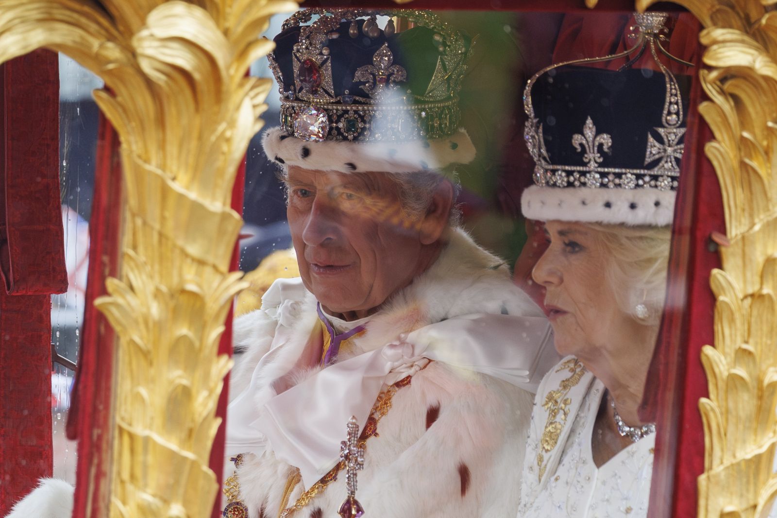 epa10612292 Britain's King Charles III and Queen Camilla travel from Westminster Abbey to Buckingham Palace following their Coronation ceremony in London, Britain, 06 May 2023. The Coronation Procession in the Gold State Coach was accompanied by members of the Armed Forces of the United Kingdom, the Commonwealth, British Overseas Territories and the Sovereign’s Bodyguard and Royal Watermen.  EPA/Tolga Akmen