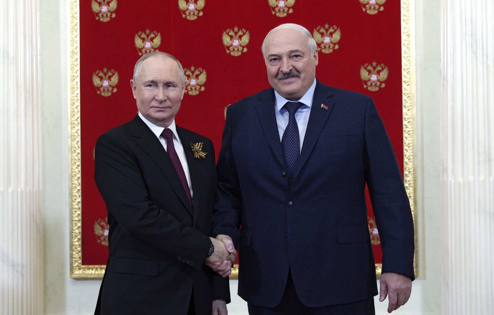 epa10616943 Russian President Vladimir Putin (L) shakes hands with Belarus President Alexander Lukashenko (R) during their meeting at the Kremlin before a Victory Day military parade on Red Square in Moscow, Russia, 09 May 2023. Russia marks the 78th anniversary of the victory in World War II over Nazi Germany and its allies. The Soviet Union lost 27 million people in the war.  EPA/VLADIMIR SMIRNOV / SPUTNIK / KREMLIN POOL MANDATORY CREDIT