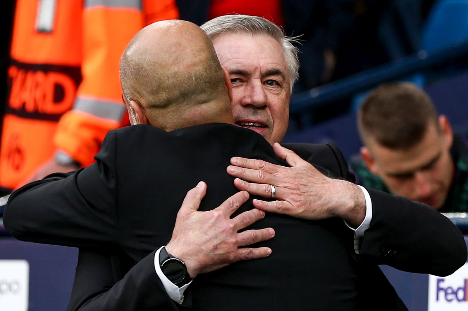 epa10634936 Real Madrid head coach Carlo Ancelotti (R) and Manchester City head coach Pep Guardiola (L) embrace before the UEFA Champions League semi-finals, 2nd leg soccer match between Manchester City and Real Madrid in Manchester, Britain, 17 May 2023.  EPA/ADAM VAUGHAN