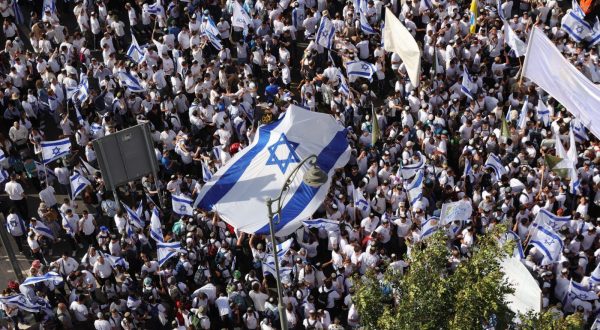 epa10636732 Participants dance and carry Israeli flags during the Israeli right-wing 'Flag March' in Jerusalem, 18 May 2023. The annual right-wing Israeli 'Flag March' commemorates the establishment of Israeli control over the Old City of Jerusalem after the six-day war in 1967. Celebrating Jerusalem Day has long been viewed by Palestinians as a provocation.  EPA/ABIR SULTAN