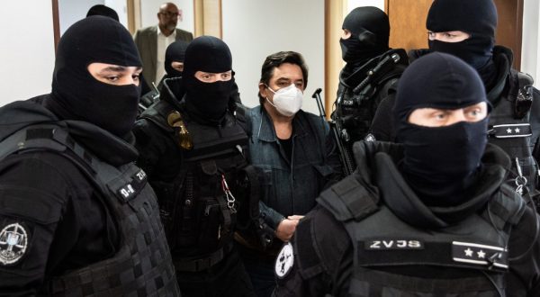 epa10638794 Slovak businessman Marian Kocner (C) is escorted by police for the main trial concerning the murder of journalist Jan Kuciak and his fiance Martina Kusnirova at the Judicial Academy building in Pezinok, Slovakia, 19 May 2023. Five years after the murder of journalist Jan Kuciak and his girlfriend Martina Kusnirova, Slovak court could pass a new judgment on Marian Kocner and Alena Zsuzsova after a new trial. The prosecution is proposing that they both receive life sentences. Both Kocner and Zsuzsova deny their guilt. The verdict from September 2020 stated that both Marian Kocner and Alena Zsuzsova are innocent in the case of the murder of Jan Kuciak and Martina Kusnirova, mainly due to a lack of evidence. The Supreme Court overturned the acquittal verdict in 2021 and remanded the case back to the trial court for reconsideration, in part because of numerous errors and illogical procedures.  EPA/JAKUB GAVLAK