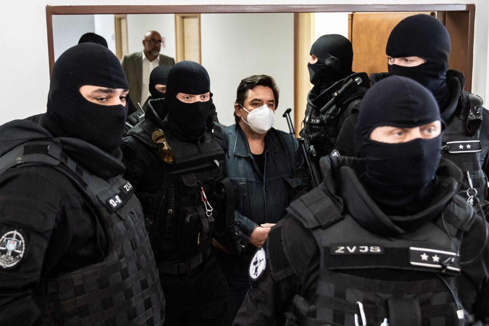 epa10638794 Slovak businessman Marian Kocner (C) is escorted by police for the main trial concerning the murder of journalist Jan Kuciak and his fiance Martina Kusnirova at the Judicial Academy building in Pezinok, Slovakia, 19 May 2023. Five years after the murder of journalist Jan Kuciak and his girlfriend Martina Kusnirova, Slovak court could pass a new judgment on Marian Kocner and Alena Zsuzsova after a new trial. The prosecution is proposing that they both receive life sentences. Both Kocner and Zsuzsova deny their guilt. The verdict from September 2020 stated that both Marian Kocner and Alena Zsuzsova are innocent in the case of the murder of Jan Kuciak and Martina Kusnirova, mainly due to a lack of evidence. The Supreme Court overturned the acquittal verdict in 2021 and remanded the case back to the trial court for reconsideration, in part because of numerous errors and illogical procedures.  EPA/JAKUB GAVLAK