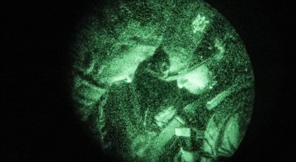 epa10639941 A picture taken through a night-vision device of Ukrainian servicemen from the 24th Mechanized Brigade 'King Danylo' at an undisclosed location in the Donetsk region, eastern Ukraine, 19 May 2023 (issued 20 May 2023), amid Russia's invasion. Russian troops entered Ukraine on 24 February 2022 starting a conflict that has provoked destruction and a humanitarian crisis.  EPA/OLEG PETRASYUK