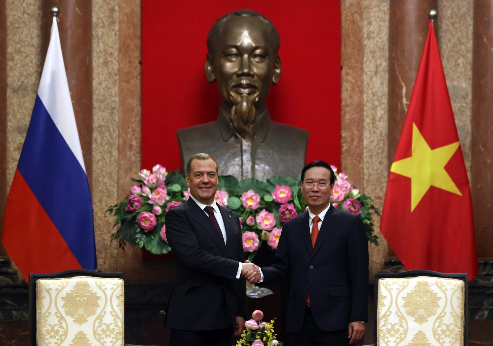 epa10645796 Deputy chairman of Russia's Security Council Dmitry Medvedev (L) and Vietnam's president Vo Van Thuong shake hands during their meeting, in Hanoi, Vietnam, 22 May 2023. Dmitry Medvedev arrived in Vietnam on a two-day working visit, he will hold talks with the country's leadership. Since December 2022, Dmitry Medvedev has been First Deputy President of the Military Industrial Commission. The commission organizes and coordinates the activities of federal departments on issues of state policy in the field of the military-industrial complex.  EPA/EKATERINA SHTUKINA / SPUTNIK / GOVERNMENT PRESS SERVICE POOL MANDATORY CREDIT
