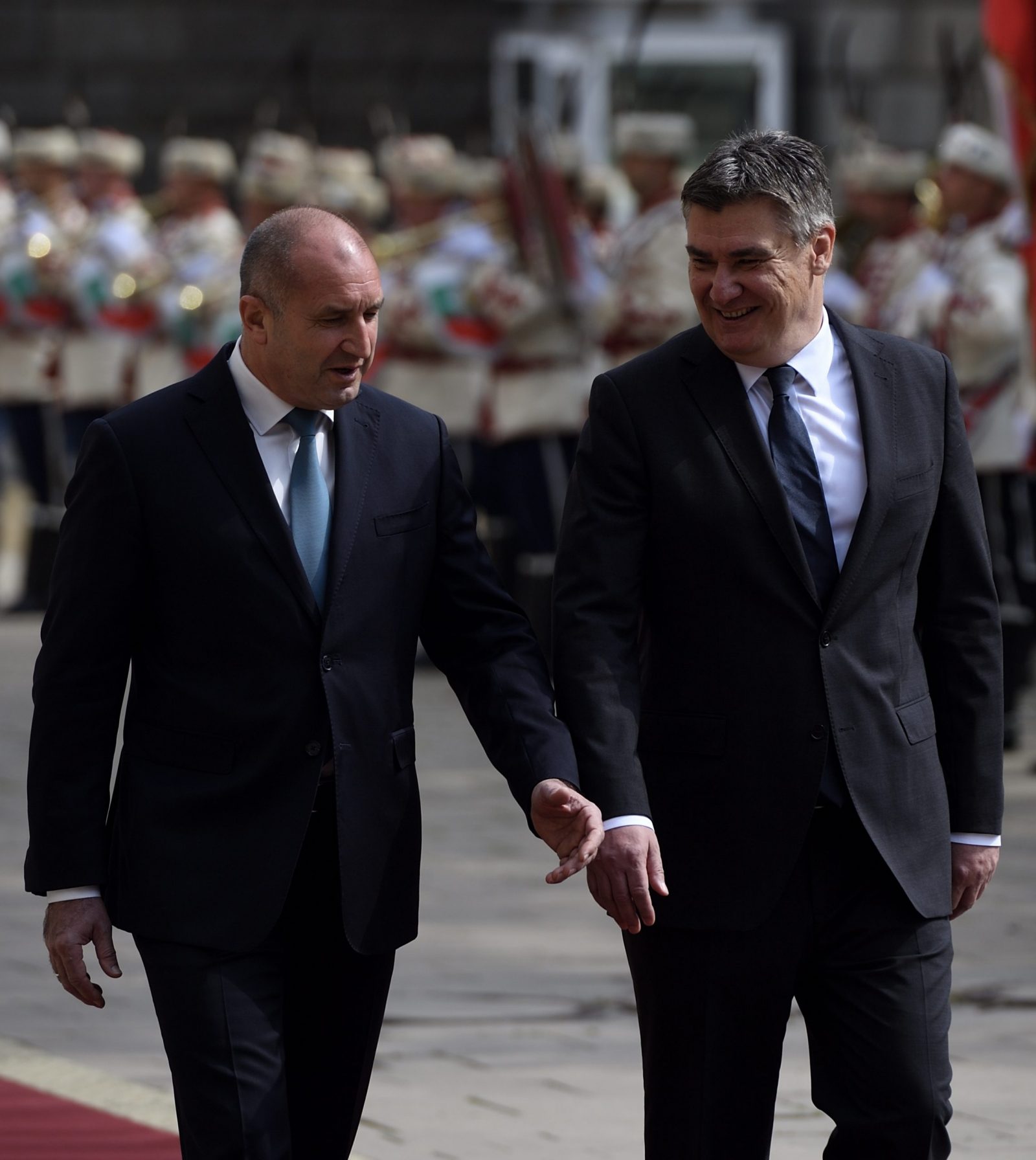 epa10652151 Bulgarian President Rumen Radev (L) and Croatia’s President Zoran Milanovic (R) review the honor guard during an official welcome ceremony in Sofia, Bulgaria, 25 May 2023. Milanovic is on an official visit to Bulgaria.  EPA/VASSIL DONEV