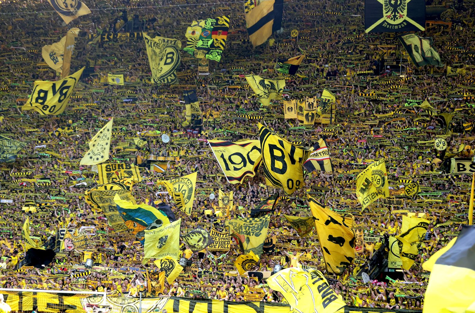 epa10657396 Fans of Borussia Dortmund wave flags before the German Bundesliga match between Borussia Dortmund and Mainz 05 in Dortmund, Germany, 27 May 2023.  EPA/FRIEDEMANN VOGEL (ATTENTION: The DFL regulations prohibit any use of photographs as image sequences and/or quasi-video.)