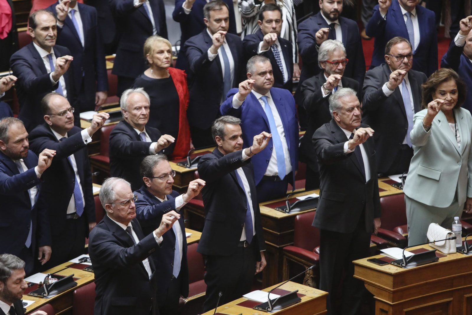 epa10660540 New Democracy party leader Kyriakos Mitsotakis (3-R) and newly-elected lawmakers attend a swearing-in ceremony at the Greek Parliament, in Athens, Greece, on 28 May 2023. Party members who won seats in Parliament in the 21 May national elections are sworn in during a ceremony attended by the Greek President Katerina Sakellaropoulou. The Parliament is expected to dissolve on 29 May, followed by an official announcement of runoff national elections to be held on 25 June.  EPA/GEORGE VITSARAS