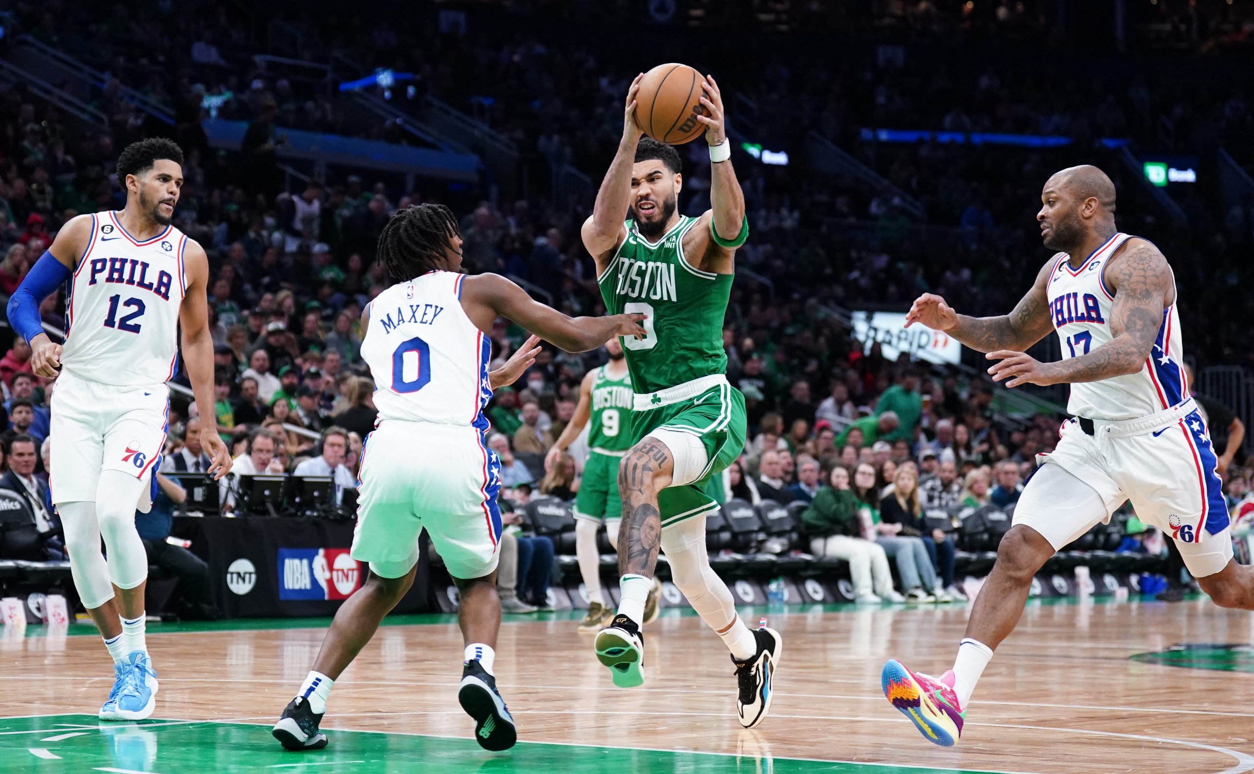 May 3, 2023; Boston, Massachusetts, USA; Boston Celtics forward Jayson Tatum (0) drives the ball against Philadelphia 76ers guard Tyrese Maxey (0) in the third quarter during game two of the 2023 NBA playoffs at TD Garden. Mandatory Credit: David Butler II-USA TODAY Sports Photo: David Butler II/REUTERS