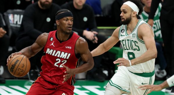 May 17, 2023; Boston, Massachusetts, USA; Miami Heat forward Jimmy Butler (22) dribbles against Boston Celtics guard Derrick White (9) during the second half in game one of the Eastern Conference Finals for the 2023 NBA playoffs at TD Garden. Mandatory Credit: Paul Rutherford-USA TODAY Sports Photo: Paul Rutherford/REUTERS