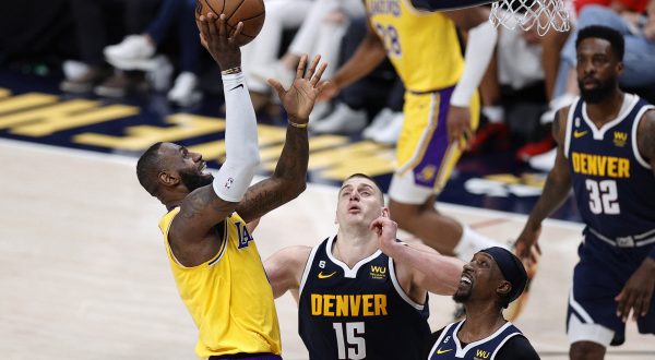 May 18, 2023; Denver, Colorado, USA; Los Angeles Lakers forward LeBron James (6) shoots against Denver Nuggets center Nikola Jokic (15) and guard Kentavious Caldwell-Pope (5) in the third quarter during game two of the Western Conference Finals for the 2023 NBA playoffs at Ball Arena. Mandatory Credit: Isaiah J. Downing-USA TODAY Sports Photo: Isaiah J. Downing/REUTERS