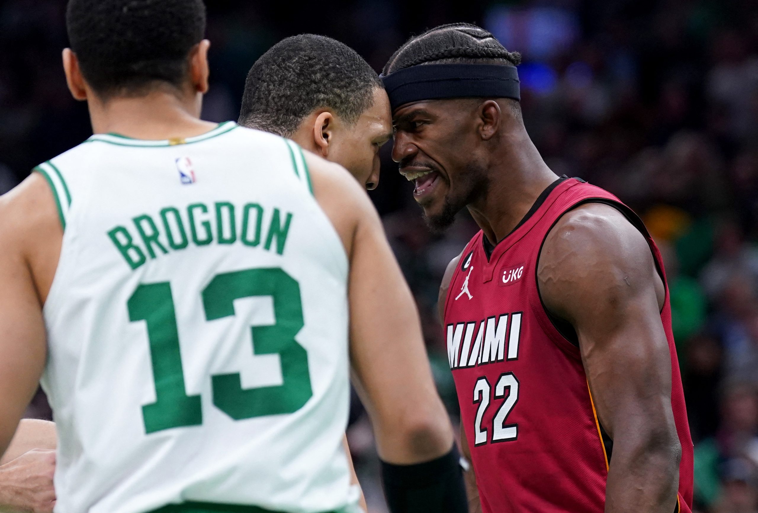 May 19, 2023; Boston, Massachusetts, USA; Boston Celtics forward Grant Williams (12) and Miami Heat forward Jimmy Butler (22) react after a play during the second half of game two of the Eastern Conference Finals for the 2023 NBA playoffs at TD Garden. Mandatory Credit: David Butler II-USA TODAY Sports Photo: David Butler II/REUTERS
