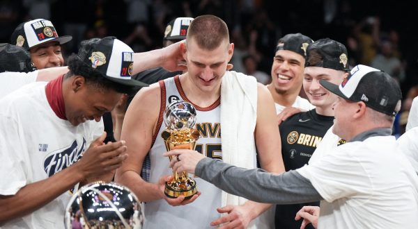 May 22, 2023; Los Angeles, California, USA; Denver Nuggets center Nikola Jokic (15) celebrates winning the Western Conference MVP Trophy and beating the Los Angeles Lakers in game four of the Western Conference Finals for the 2023 NBA playoffs at Crypto.com Arena. Mandatory Credit: Kirby Lee-USA TODAY Sports Photo: Kirby Lee/REUTERS