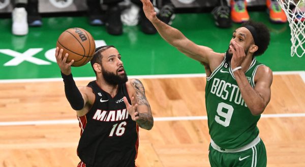 May 25, 2023; Boston, Massachusetts, USA; Miami Heat forward Caleb Martin (16) shoots against Boston Celtics guard Derrick White (9) in the first quarter during game five of the Eastern Conference Finals for the 2023 NBA playoffs at TD Garden. Mandatory Credit: Brian Fluharty-USA TODAY Sports Photo: Brian Fluharty/REUTERS