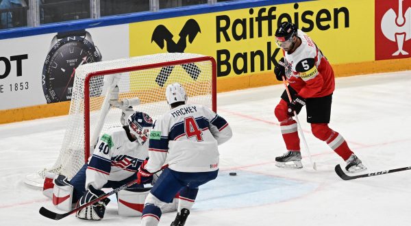 epa10634184 Thomas Raffl (R) from Austria
scores a goal  during the IIHF 2023 Ice Hockey World Championship group A match between USA and Austria in Tampere, Finland, 17 May 2023.  EPA/KIMMO BRANDT
