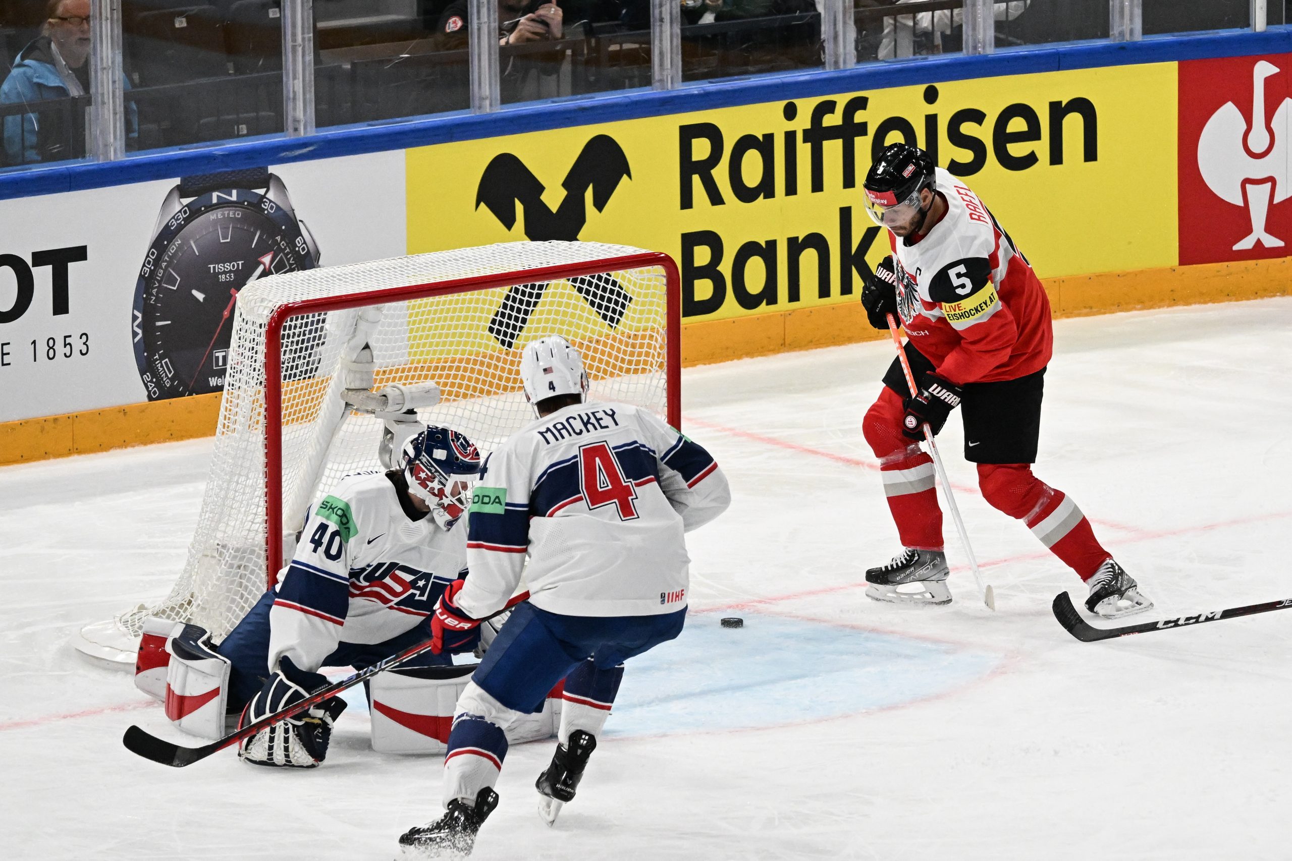 epa10634184 Thomas Raffl (R) from Austria
scores a goal  during the IIHF 2023 Ice Hockey World Championship group A match between USA and Austria in Tampere, Finland, 17 May 2023.  EPA/KIMMO BRANDT