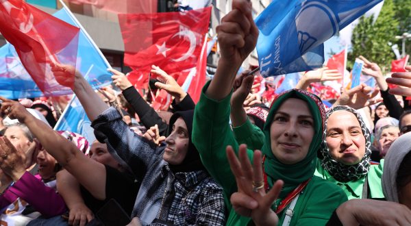 epa10625085 Supporters of Turkish President Recep Tayyip Erdogan greet  during his election campaign rally at Beyoglu district in Istanbul, Turkey, 13 May 2023. Turkey will hold its general election on 14 May 2023 with a two-round system to elect its president, while parliamentary elections will be held simultaneously.  EPA/TOLGA BOZOGLU