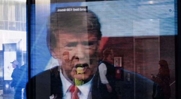 epaselect epa10635306 An image of former President Donald Trump reflected in a window in New York, New York, USA, 17 May 2023. Trump announced his 2024 candidacy to be US president and is considered to be the Republican party’s front-runner.  EPA/JUSTIN LANE